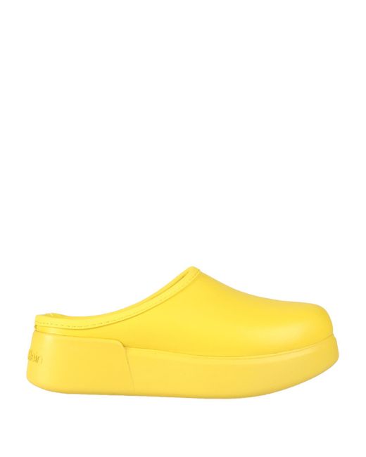 Calvin Klein Yellow Mules & Clogs