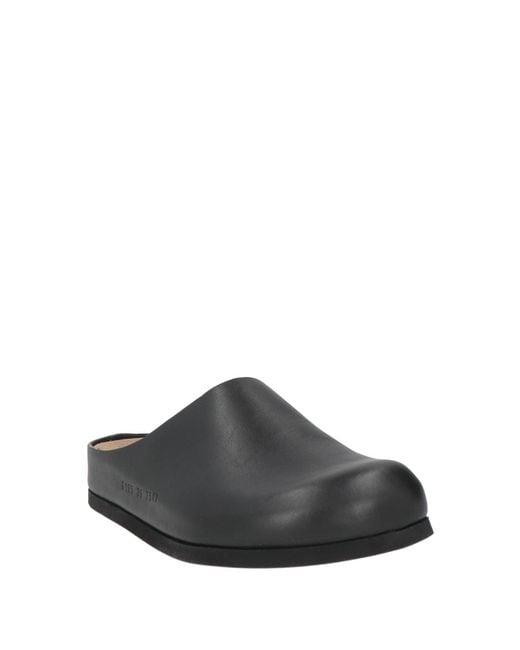 Common Projects Black Mules & Clogs