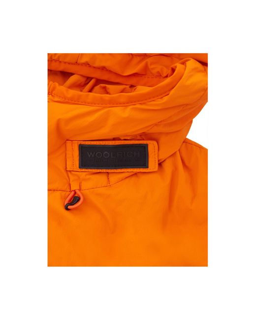 Plumífero y acolchado Woolrich de hombre de color Orange