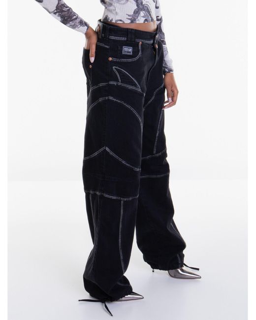 Pantalon en jean Versace en coloris Black