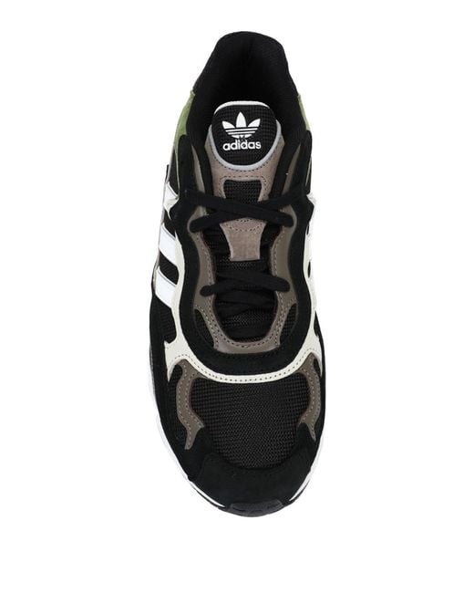 all black low top adidas