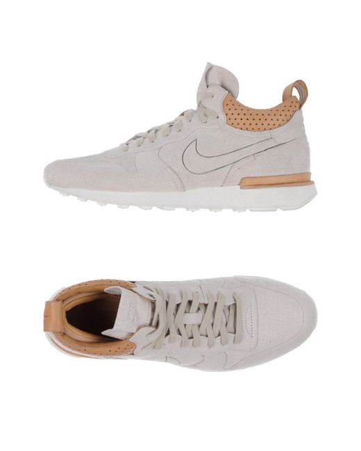 tan nike low tops