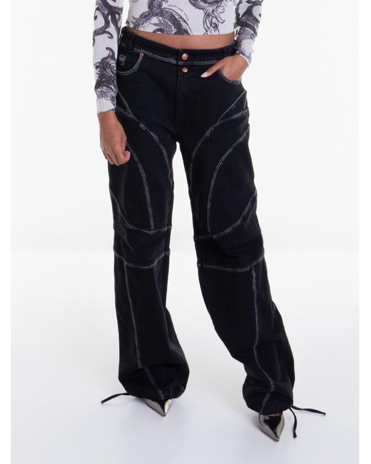 Pantalon en jean Versace en coloris Black