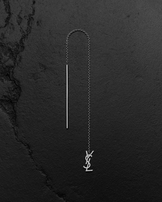 Orecchino singolo pendente lungo cassandre in oro bianco 18 k di Saint Laurent in Black