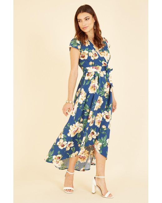 Mela London Blue Mela Painted Floral Print Dipped Hem Wrap Dress