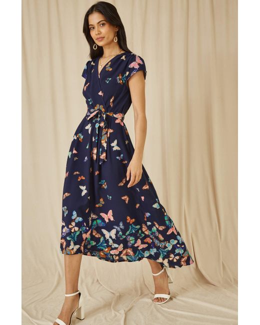 Yumi' Blue Butterfly Print Dip Hem Midi Wrap Dress