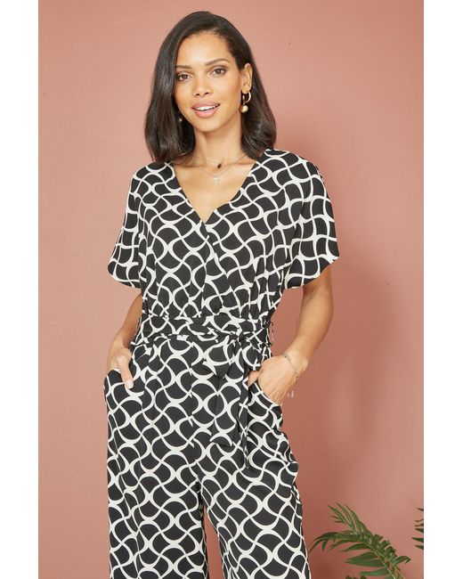 Yumi' Black Geometric Print Wrap Jumpsuit