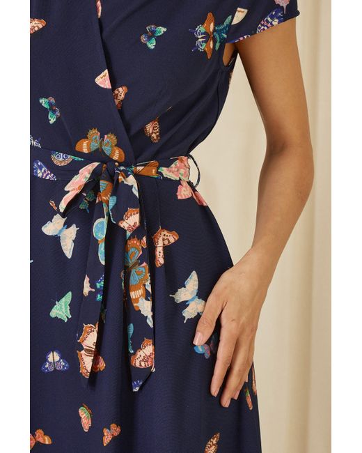Yumi' Blue Butterfly Print Dip Hem Midi Wrap Dress