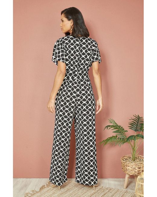 Yumi' Black Geometric Print Wrap Jumpsuit