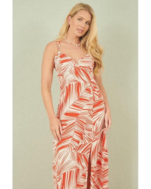 Yumi' Orange Leaf Print Maxi Dress With Cross Back