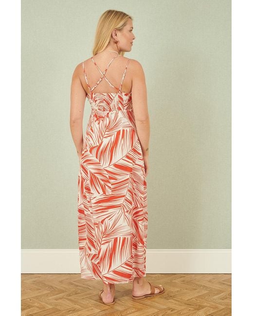 Yumi' Orange Leaf Print Maxi Dress With Cross Back