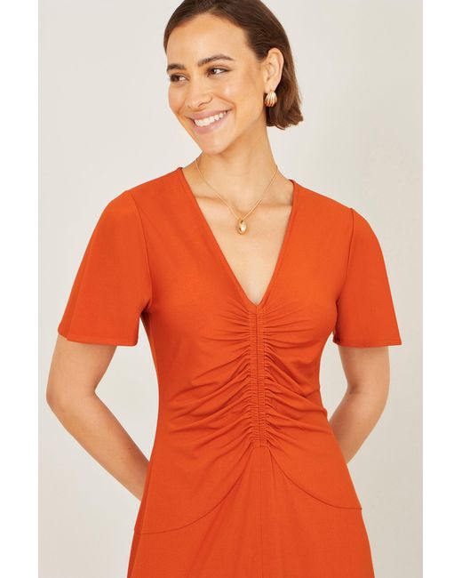 Yumi' Orange Ruched Front Stretch Midi Dress
