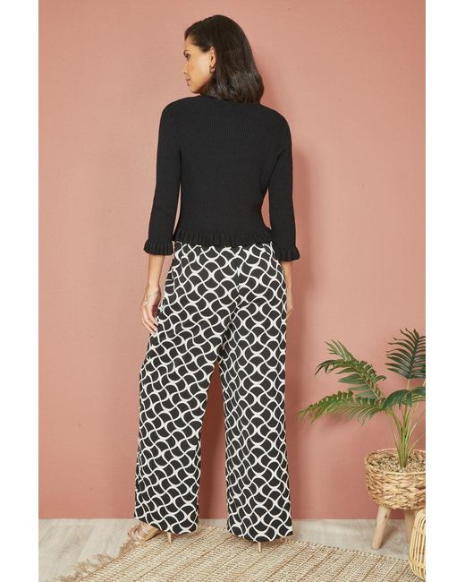 Yumi' Black Tie Up Ribbed Cardigan With Frill Hem