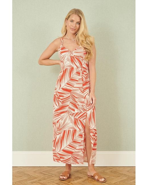 Yumi' Orange Leaf Print Maxi Dress With Cross Back