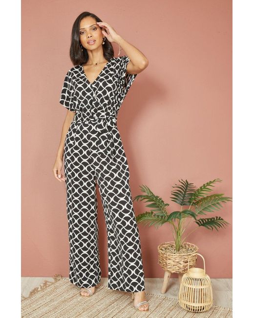 Yumi' Black Geometric Print Wrap Jumpsuit