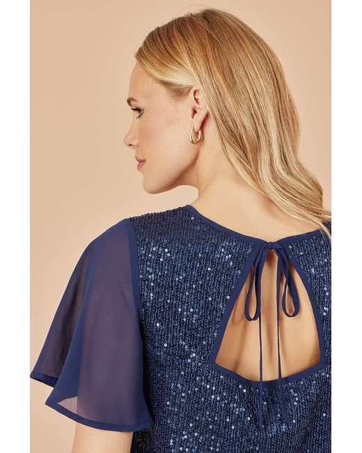 Yumi' Blue Sequin Top With Sheer Sleeves And Cut Out Back