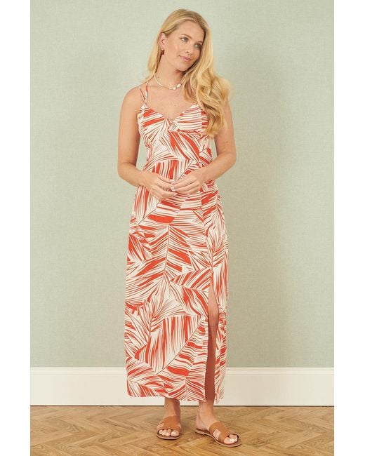 Yumi' Orange Leaf Print Maxi Dress With Cross Back