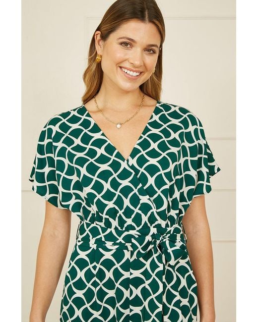 Yumi' Green Geometric Print Wrap Jumpsuit