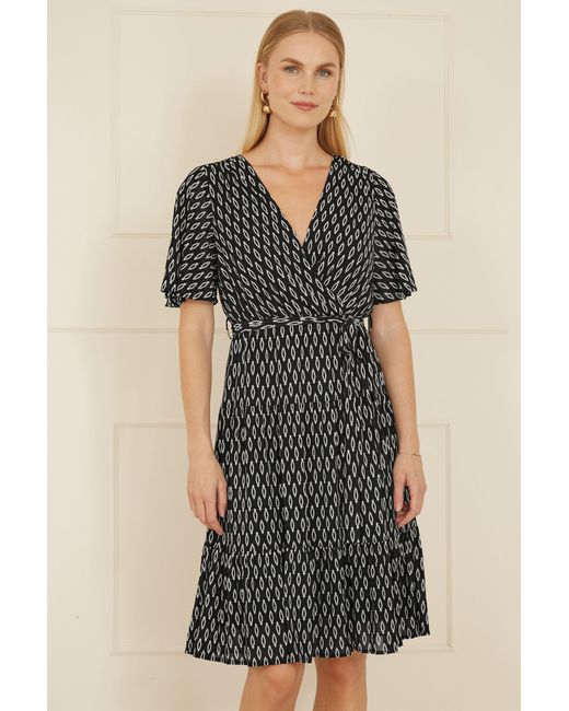 Yumi' Black Geo Print Mesh Stretch Midi Skater Dress
