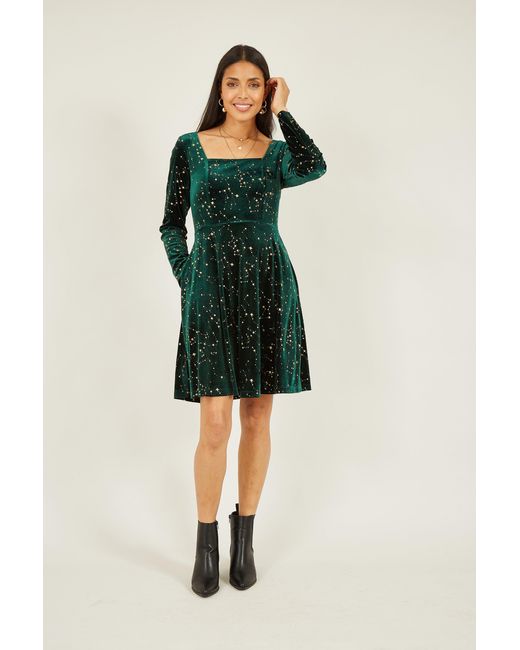Yumi' Green Star Foil Print Long Sleeve Skater Dress