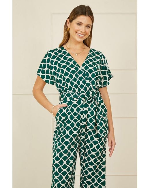 Yumi' Green Geometric Print Wrap Jumpsuit