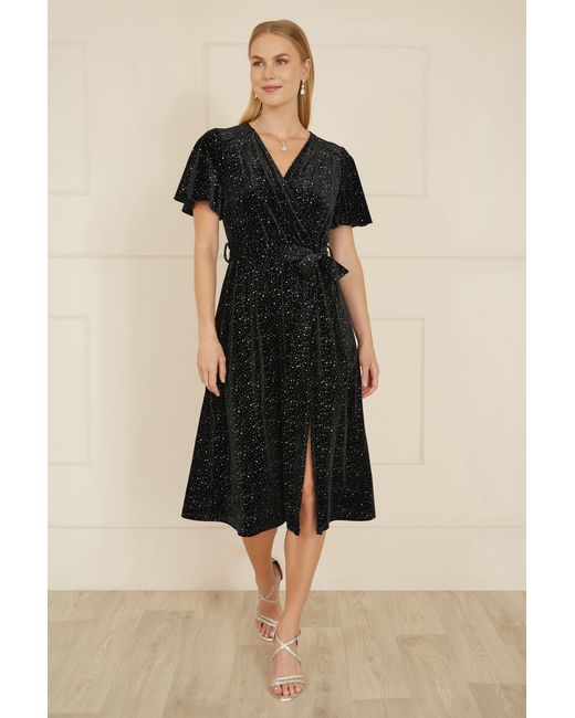 Yumi' Black Velvet Sparkle Wrap Angel Sleeve Dress