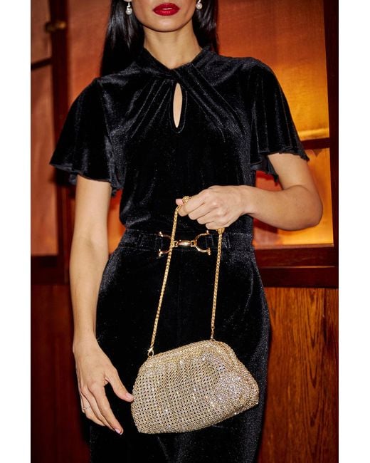Yumi' Orange Velvet Jumpsuit With Twist Neckline And Buckle Belt