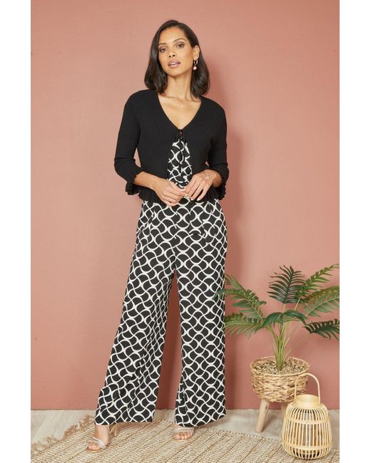 Yumi' Black Tie Up Ribbed Cardigan With Frill Hem