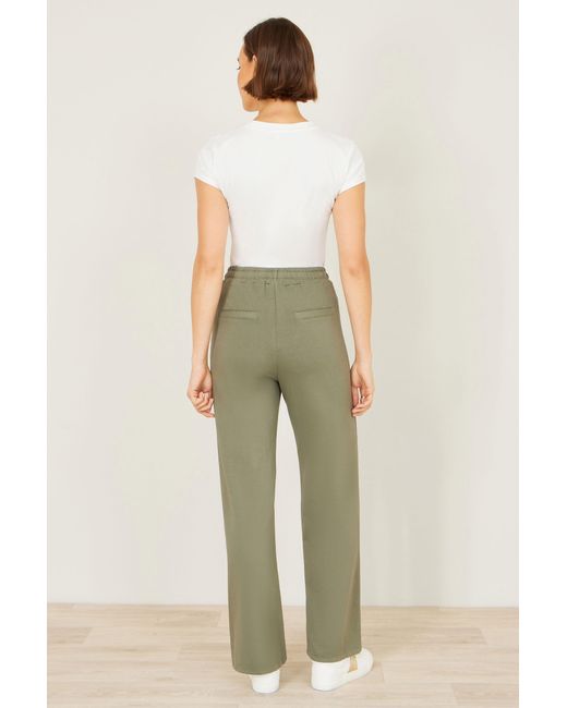 Yumi' Natural Relaxed Stretch Wide Leg Trousers With Pockets