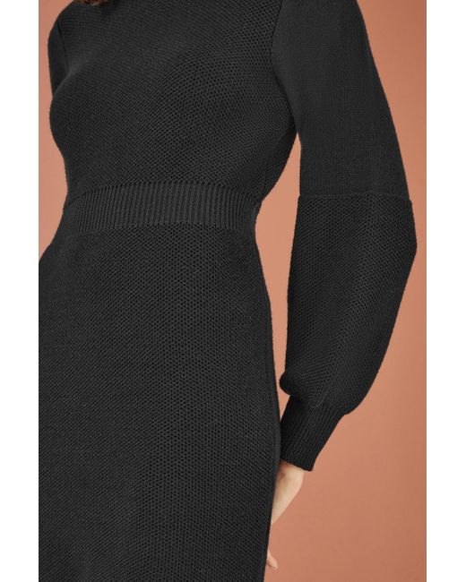 Yumi' Black Roll Neck Knitted Dress With Fitted Waist