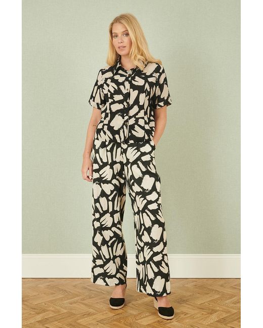 Yumi' Black Cotton Splash Print Relaxed Fit Trousers