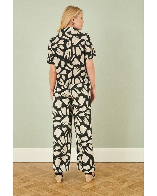 Yumi' Black Cotton Splash Print Relaxed Fit Trousers