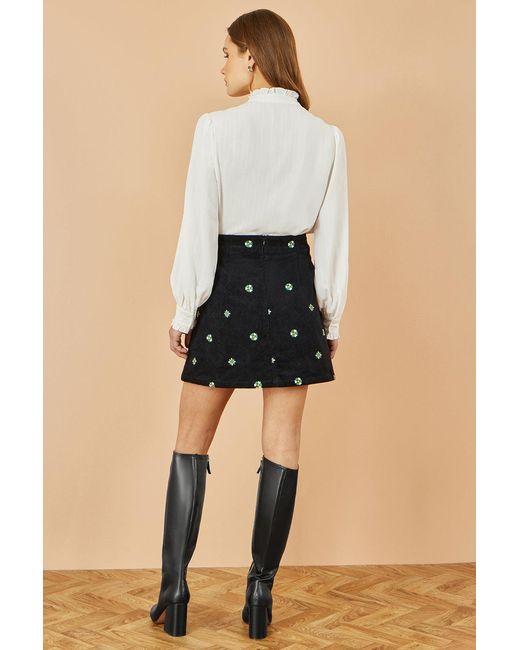 Yumi' Natural Flower Embroidered Cord Mini Skirt