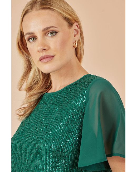 Yumi' Green Sequin Top With Sheer Sleeves And Cut Out Back
