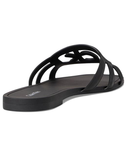 【 】★サンダル★ Women's Yoana Slip-On Sandals Calvin Klein Women's Yoana Logo Slip-On Jelly Flat Sandals