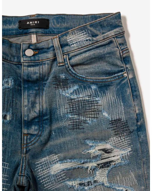 Amiri All Over Repair Clay Indigo Jeans in Blue for Men | Lyst