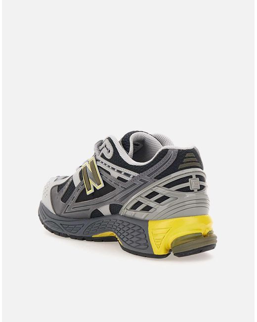 New Balance Gray M1906 Graue Sneakers Mit Gelben Details