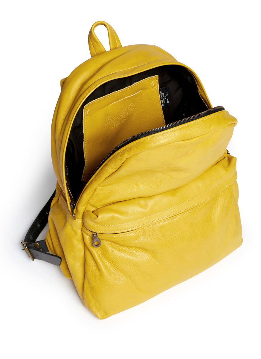 yellow leather backpack
