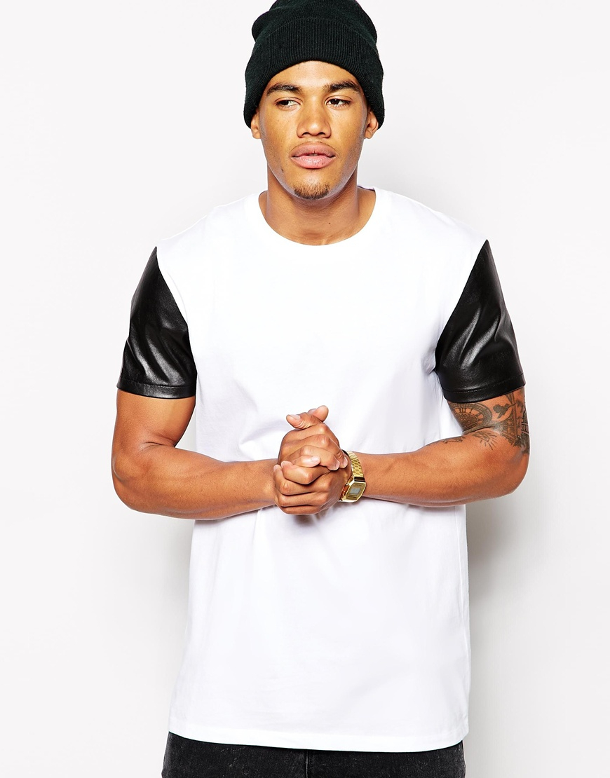 White shirt with leather sleeves The Tillman Leather Cape Sleeve # from Welders Supply provides excellent protection for your chest, shoulders and sleeves. This is a bourbon brown premium side split cowhide cape sleeve. It comes with a 20” leather bib (optional 14