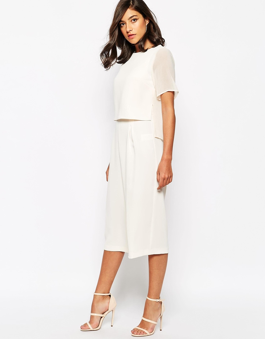 cream jumpsuit with cape