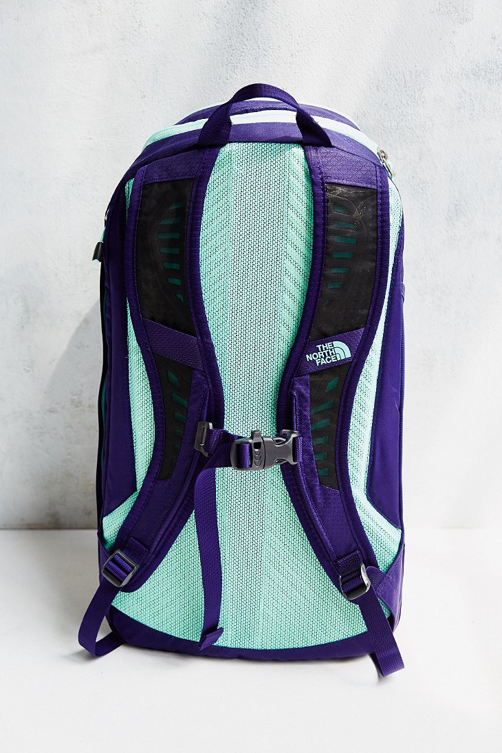 teal and purple north face backpack
