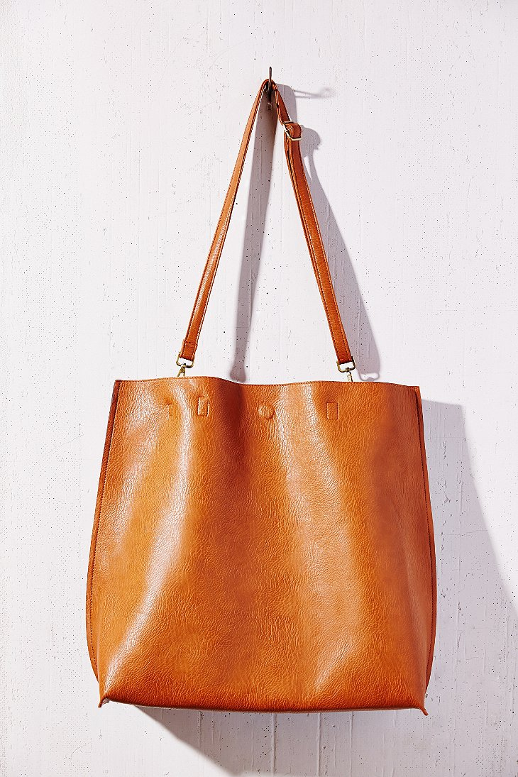 Lyst - Urban Outfitters Oversized Reversible Vegan Leather Tote Bag in ...