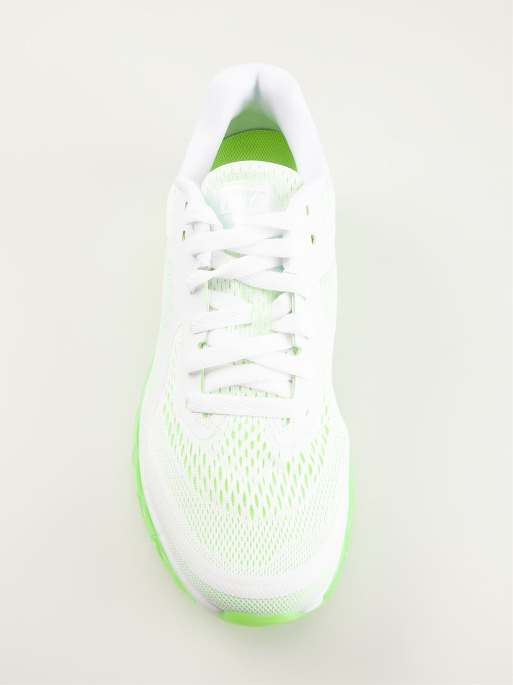 white and neon nike shoes
