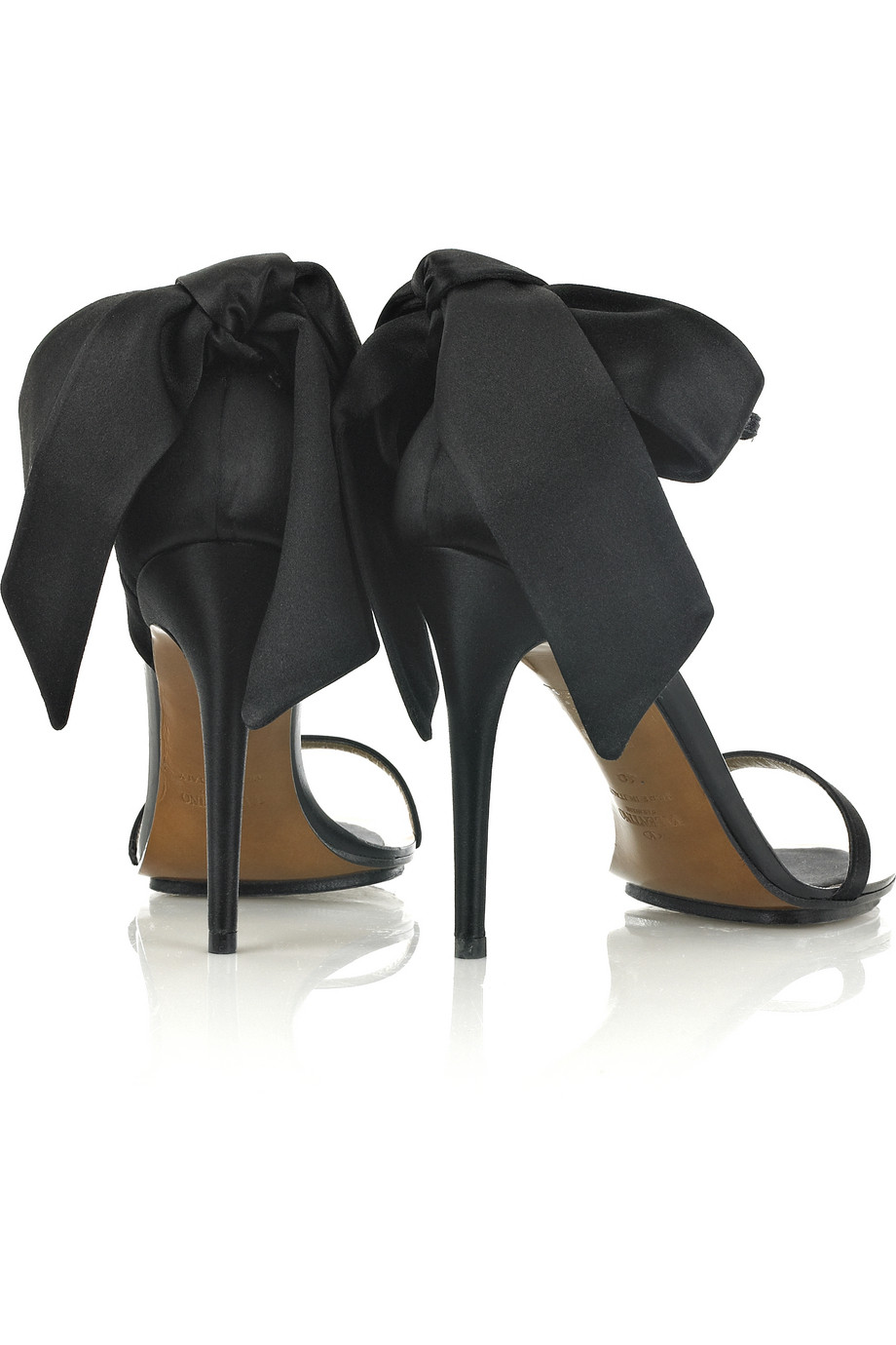 black heels with bow on back
