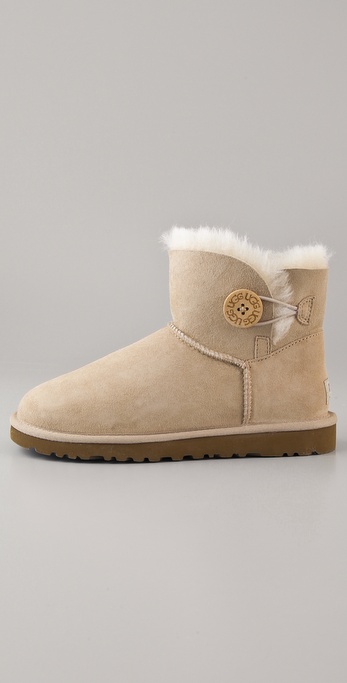 UGG Mini Bailey Button Booties in Sand (Natural) | Lyst