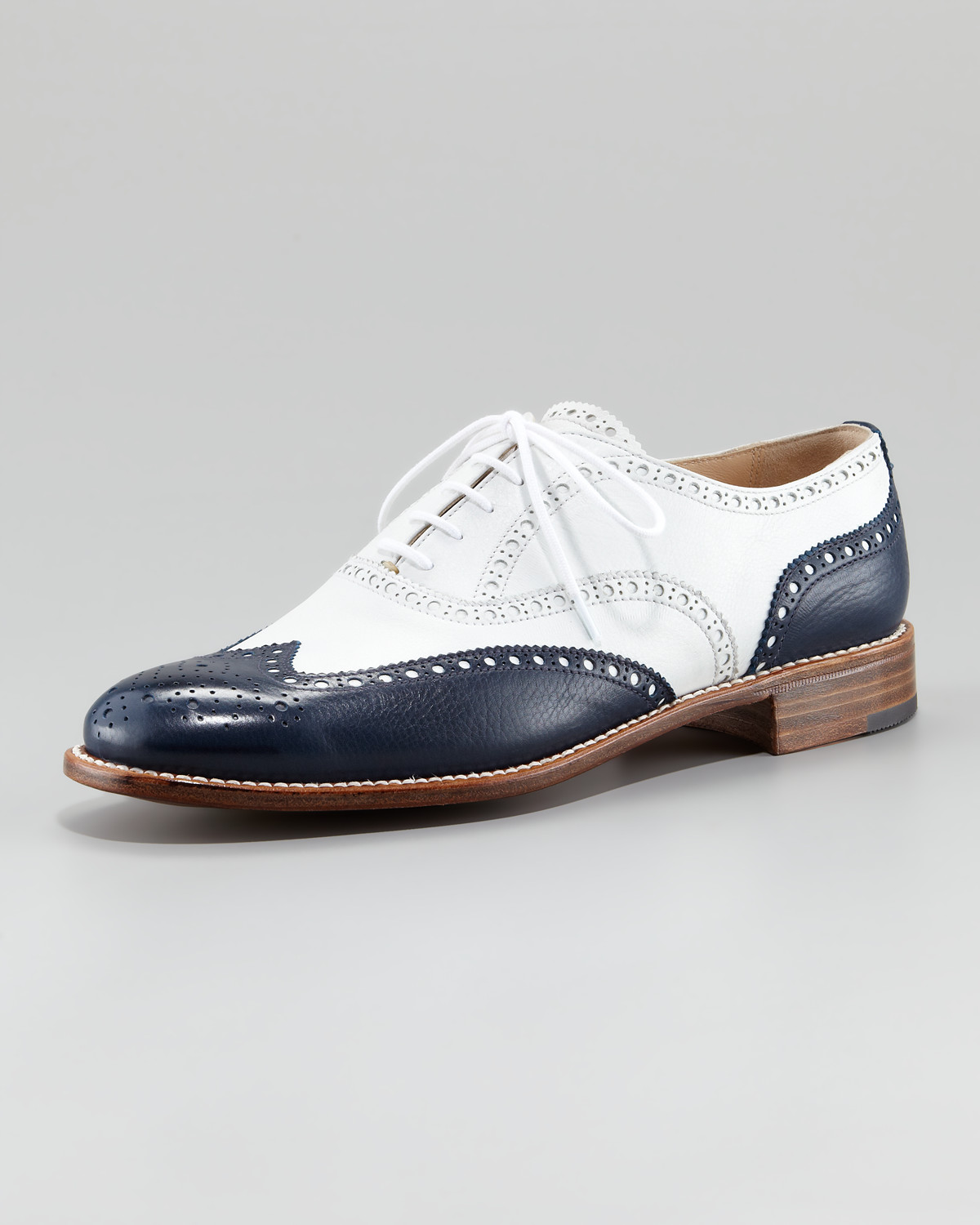 blue and white wingtip shoes