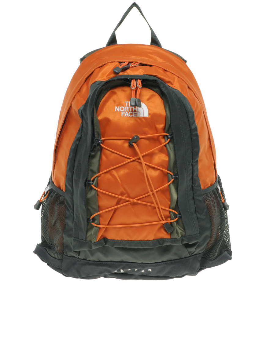 grey and orange north face backpack