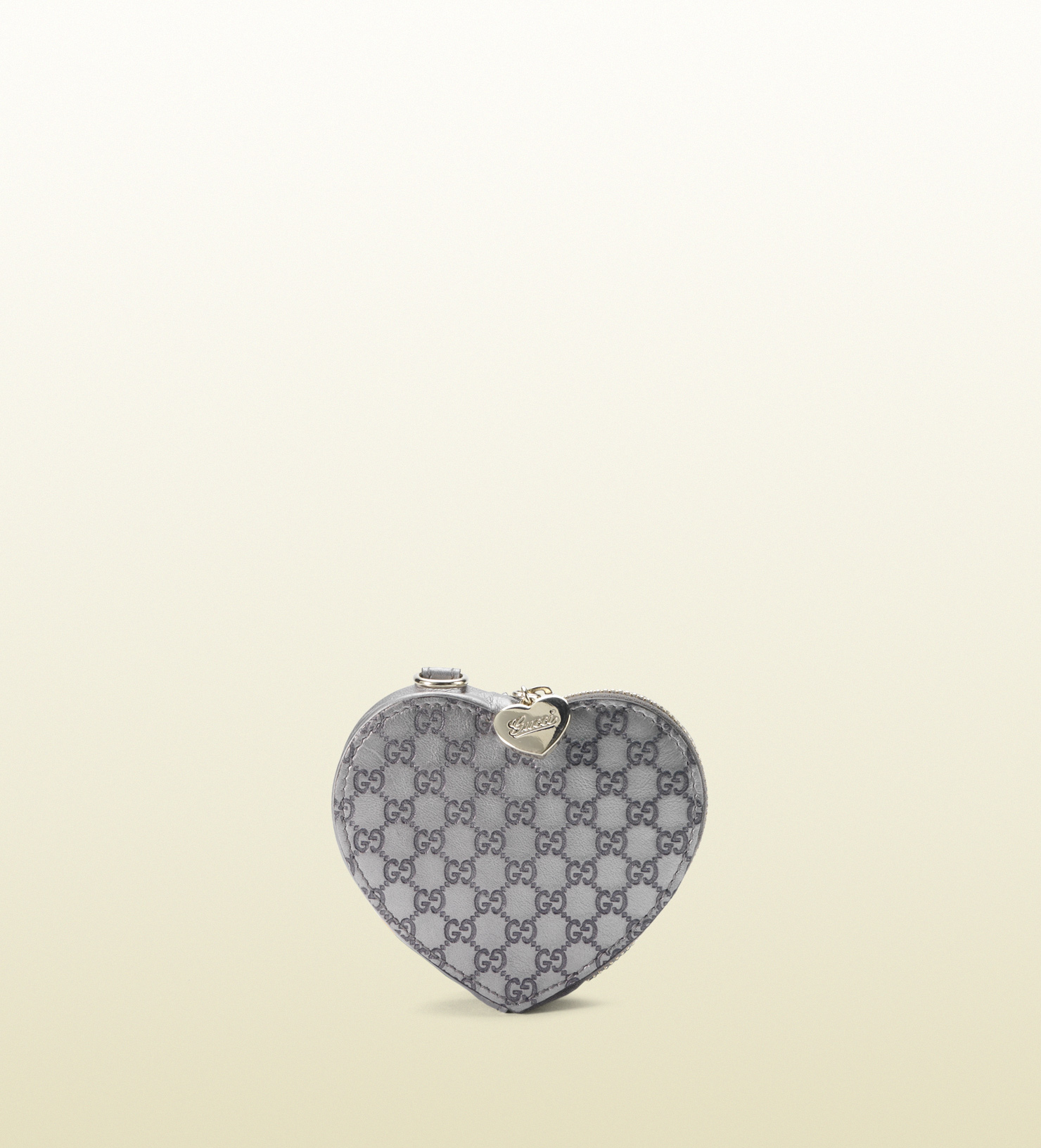 white gucci purse with heart on back