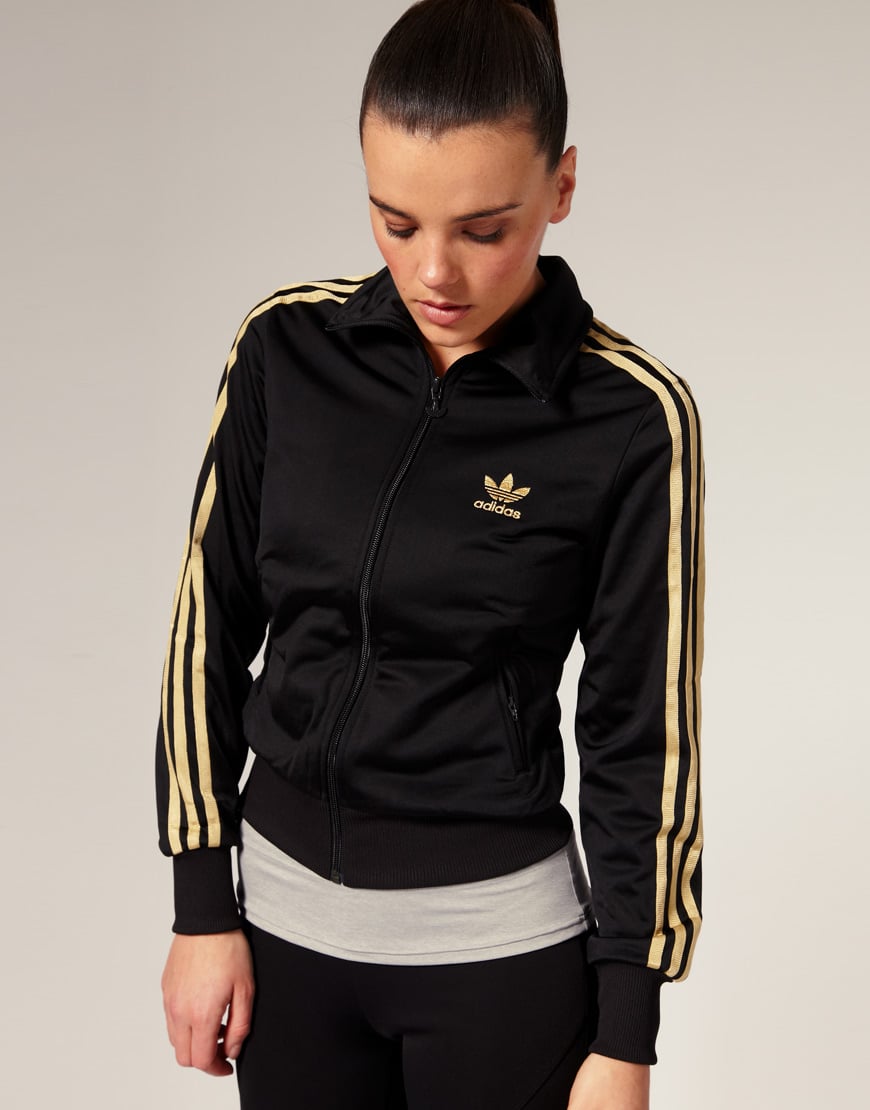 black adidas track jacket with gold stripes