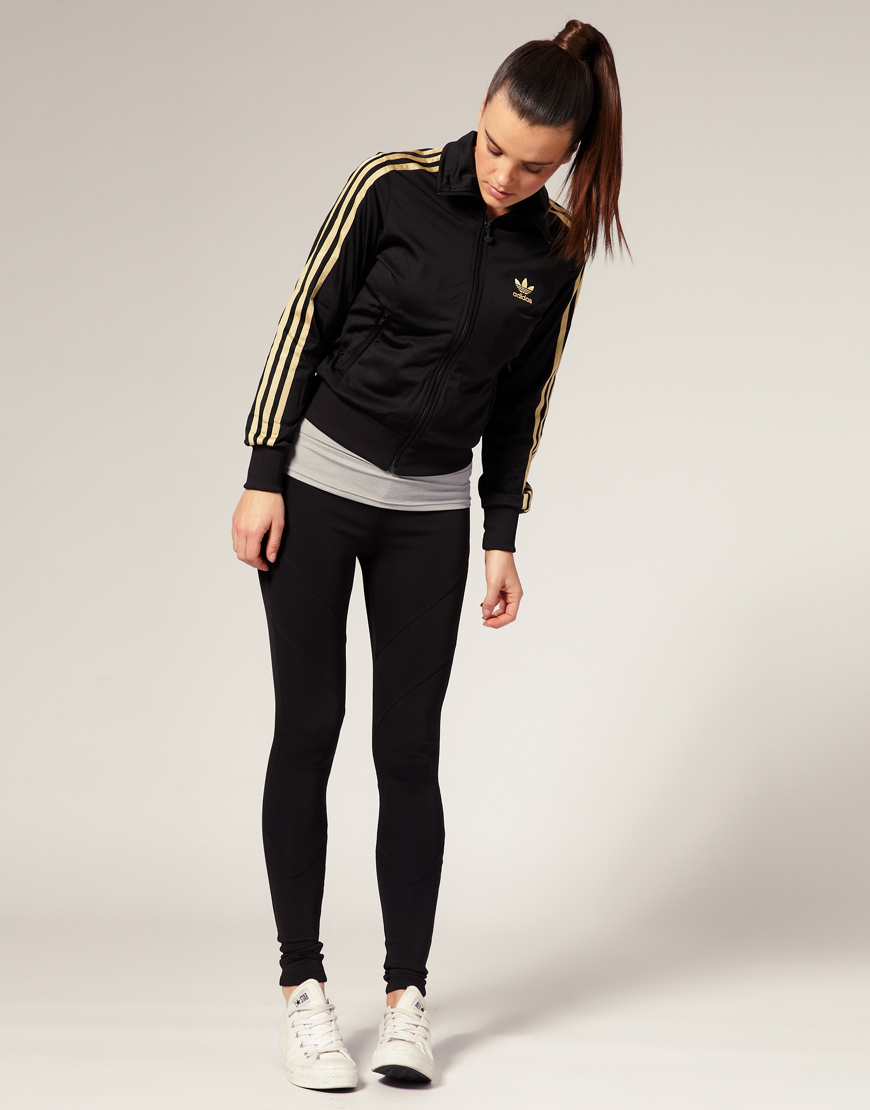 black adidas track jacket with gold stripes